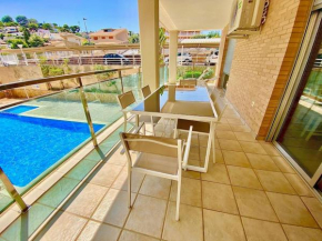 Modern apartment with pool close to the beach.